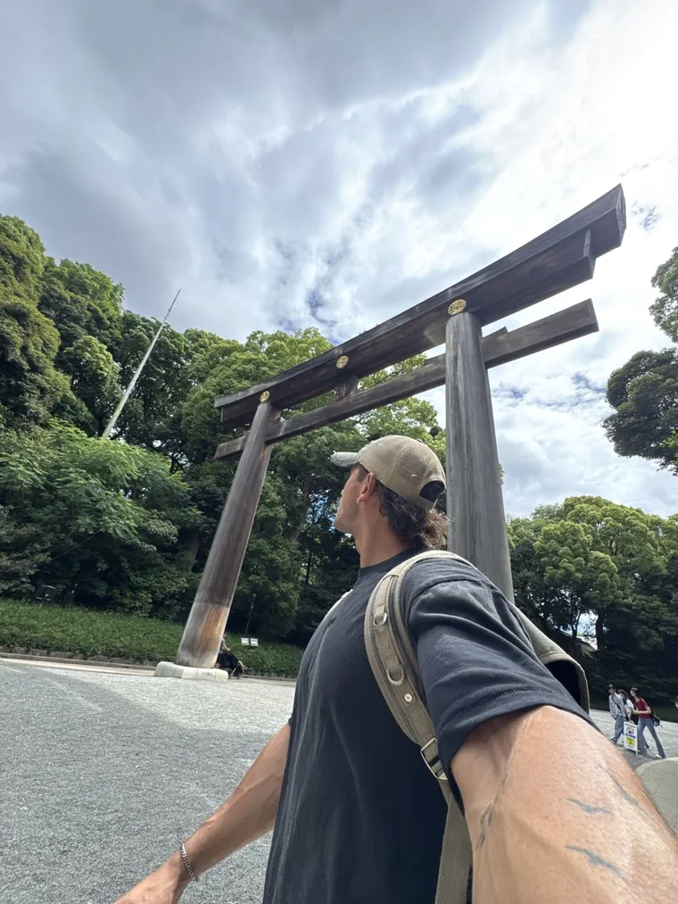A coach at a torii gate while travelling